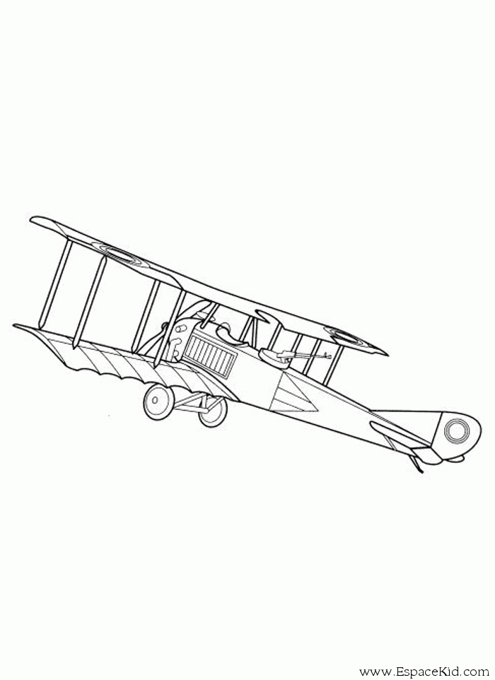 Un avion en plein vol sur fond de ciel dégagé Un avion en plein vol sur fond de ciel dégagé