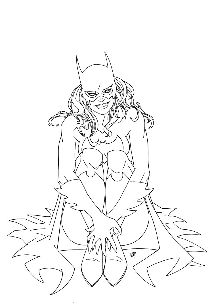 Batgirl en pleine action avec son emblématique costume dans un décor urbain