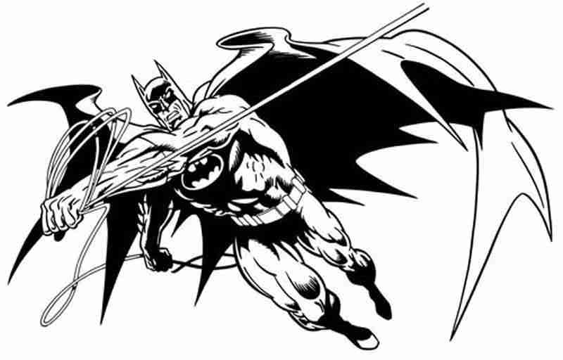 Batman en pleine action dans un décor urbain