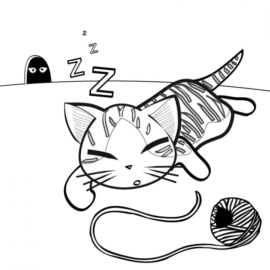 Un chaton joue avec une pelote de laine sur un tapis