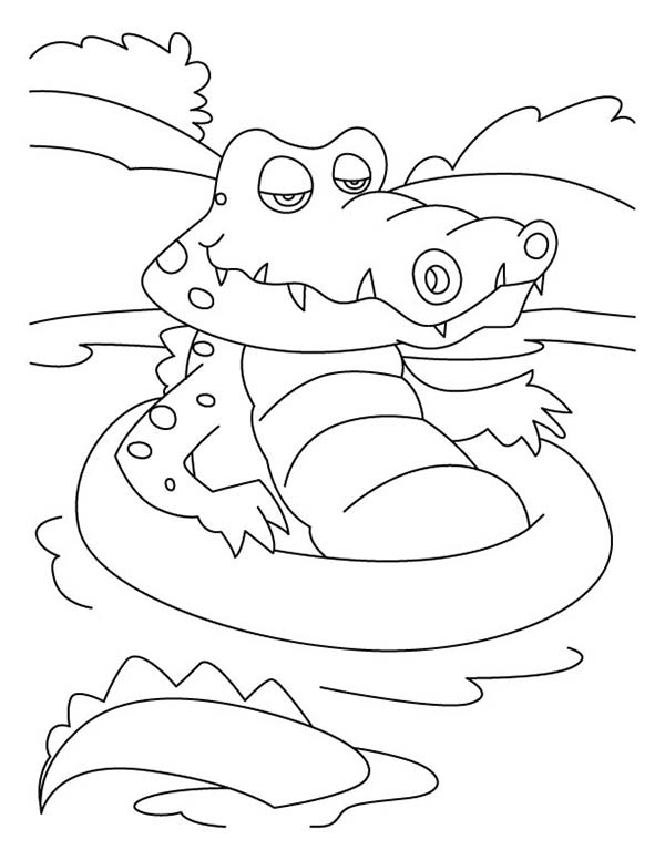 Coloriage d'un crocodile sur la rive d'une rivière