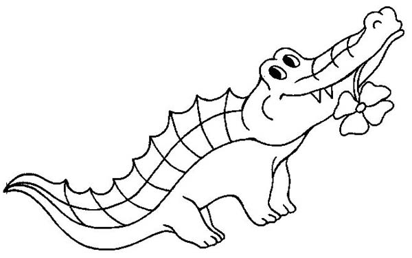 Coloriage d'un crocodile se reposant au bord de l'eau
