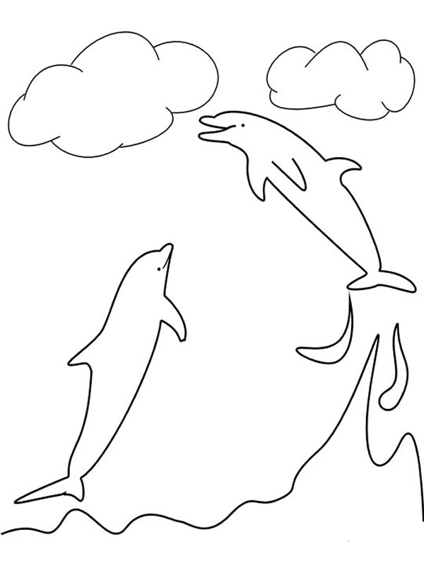 Un dauphin sautant joyeusement au-dessus des vagues Un dauphin sautant joyeusement au-dessus des vagues