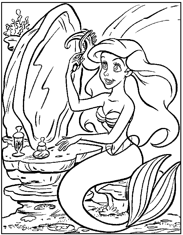 La petite sirène joue avec des poissons dans son monde sous-marin