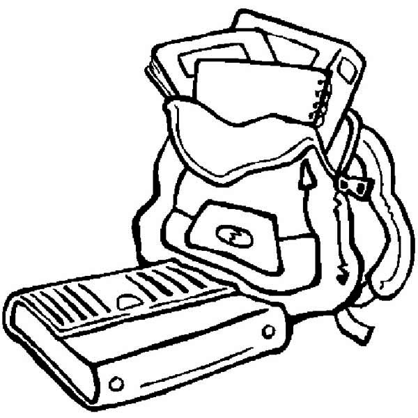 Coloriage de matériel scolaire sur une table de travail
