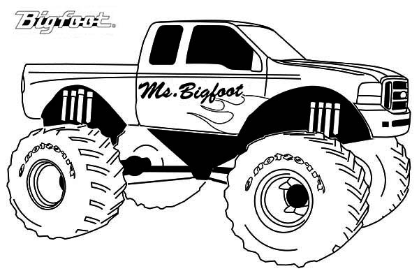 Un monster truck en pleine action sur un terrain accidenté Un monster truck en pleine action sur un terrain accidenté