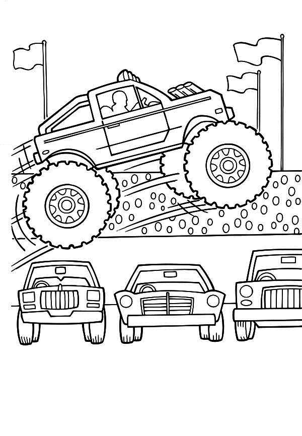 Coloriage d'un monster truck sur un terrain accidenté Coloriage d'un monster truck sur un terrain accidenté