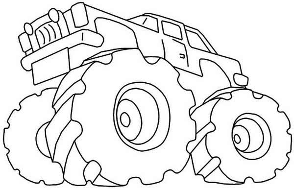 Monster truck en pleine action sur un terrain accidenté Monster truck en pleine action sur un terrain accidenté