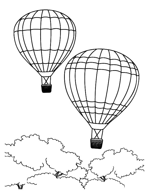 Montgolfières flottant dans un ciel dégagé