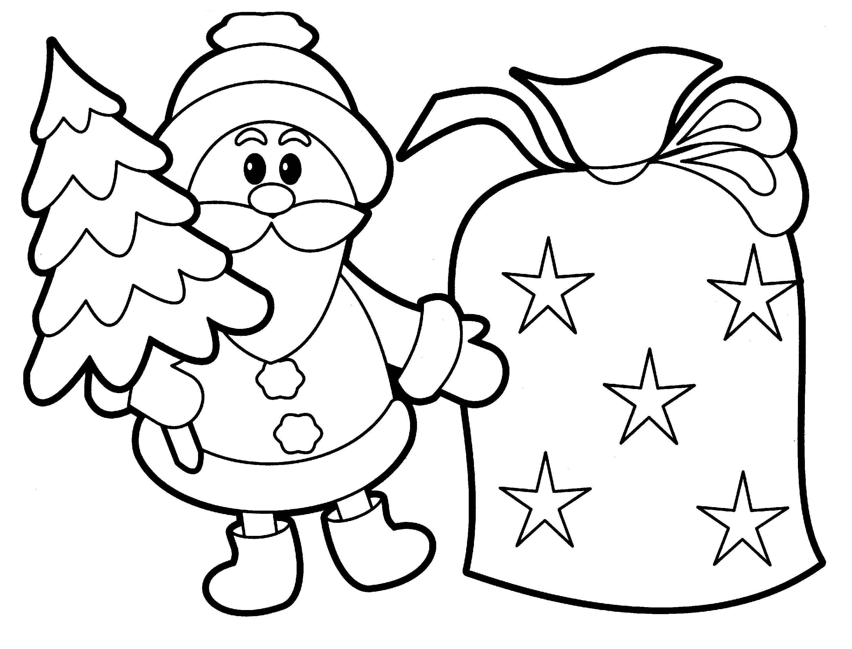 Un groupe d'enfants préparant des décorations de Noël autour d'un sapin