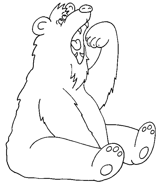 Un ours assis, contemplant son environnement naturel