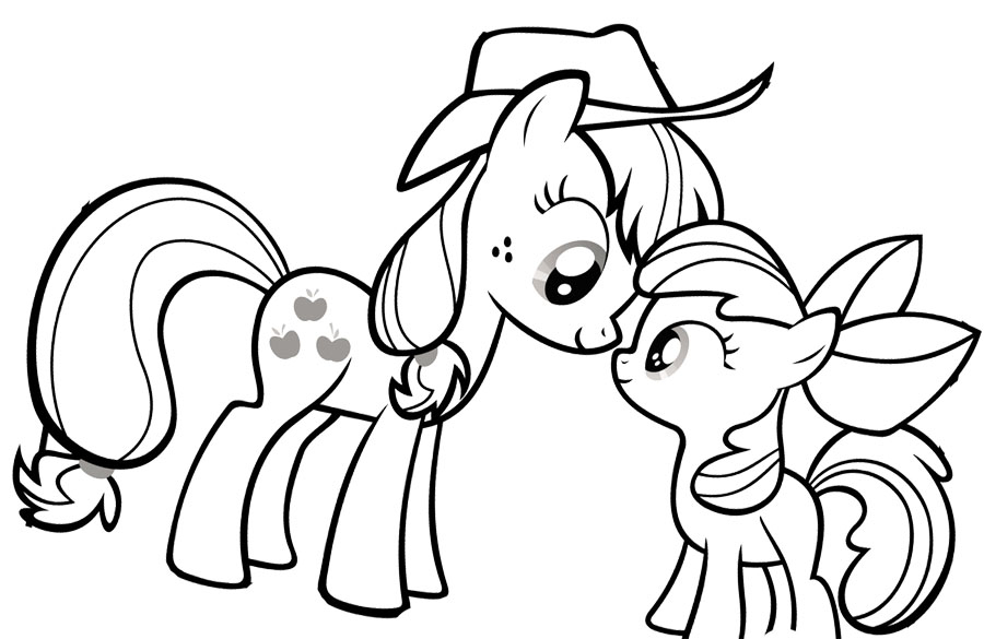 Un petit poney se détend dans un champ verdoyant