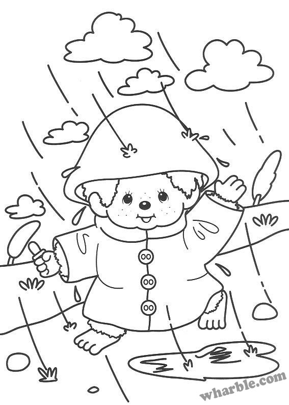Un enfant joyeux sous la pluie avec un parapluie coloré
