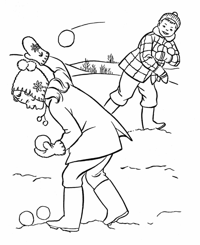 Un enfant construisant un bonhomme de neige sous les flocons Un enfant construisant un bonhomme de neige sous les flocons