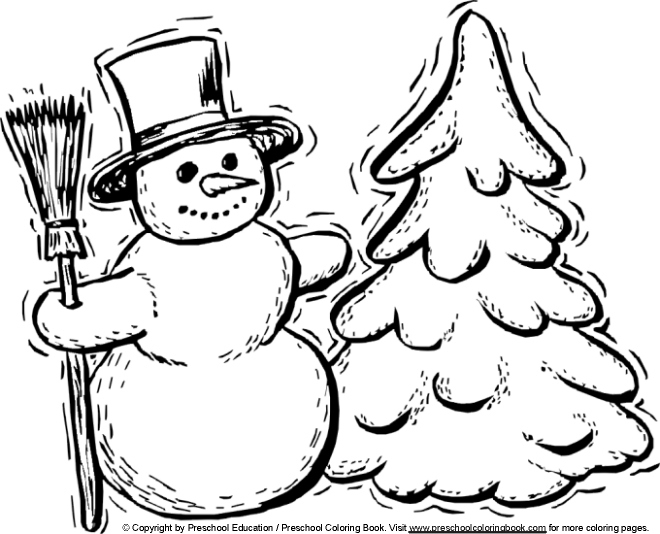 Un enfant s'amuse à construire un bonhomme de neige en hiver