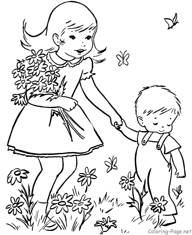 Un enfant joyeux cueille des fleurs au printemps dans un jardin coloré